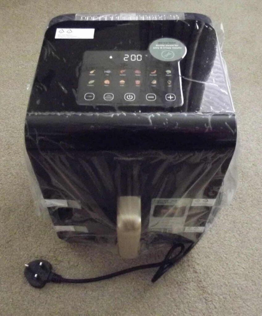 view of our own purchase testing panasonic nf cc600axc budget air fryer uk under £100 unboxing package arrival several weeks to months